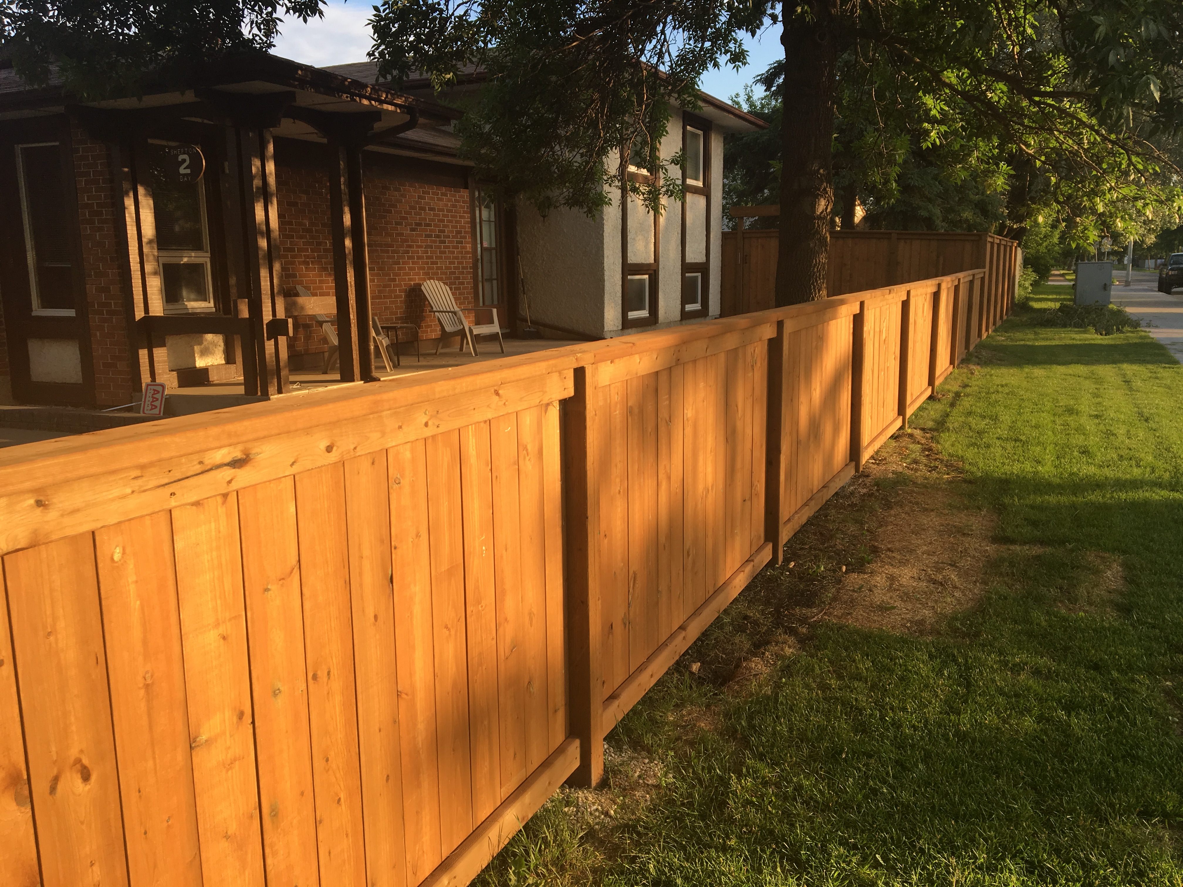 Brown treated wood fence